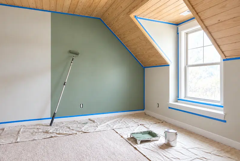 Interior painting Hardin Valley TN - bonus room wall freshly painted sage green under a wood ceiling