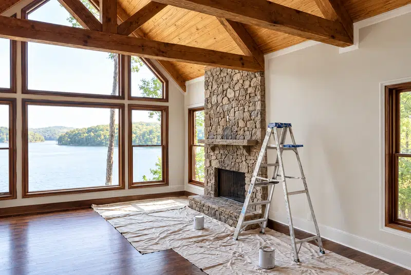 Vaulted lake-view great room with freshly painted walls and ladder, interior painting in Lenoir City, TN by Castle Painters